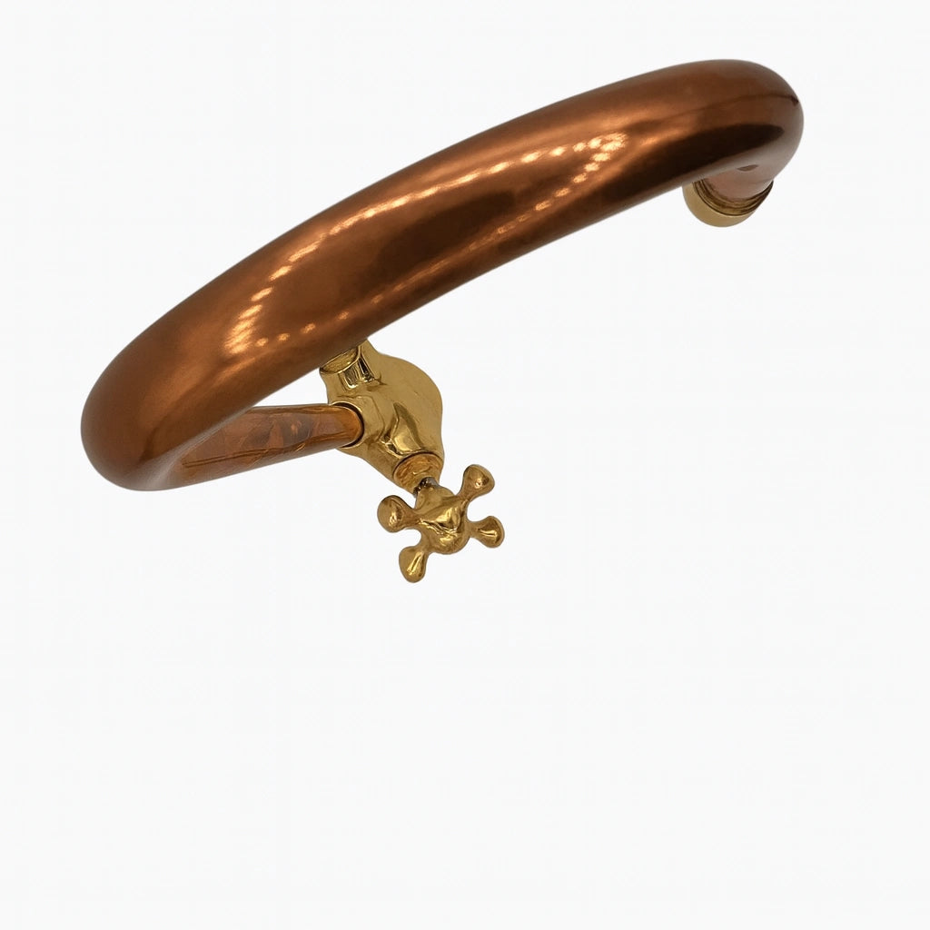 Copper and gold handle on a white background