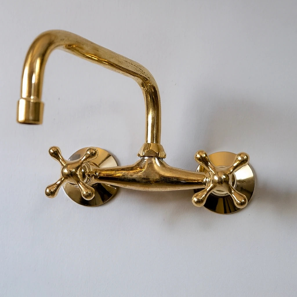 Gold faucet on a white background