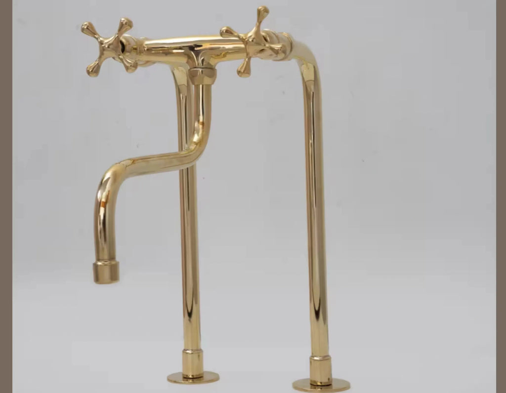 brass faucet on a gray background